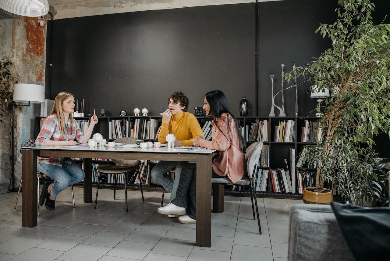 A Group of People Having a Meeting in the Office